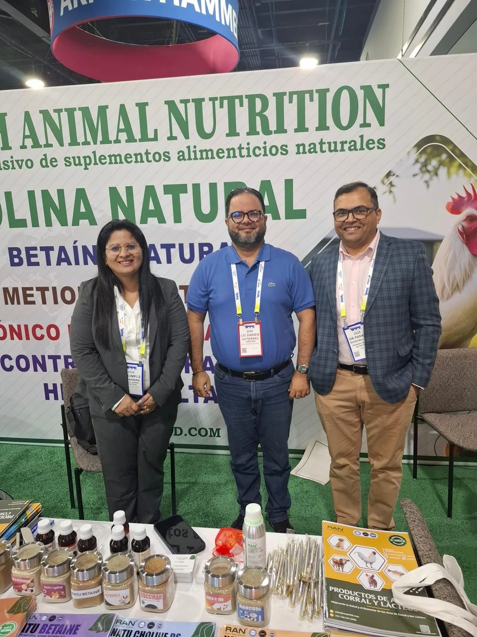 Three representatives at the Rivansh Animal Nutrition booth at IPPE Atlanta