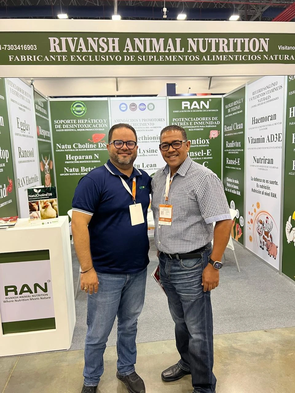 Two men pose at the RAN booth